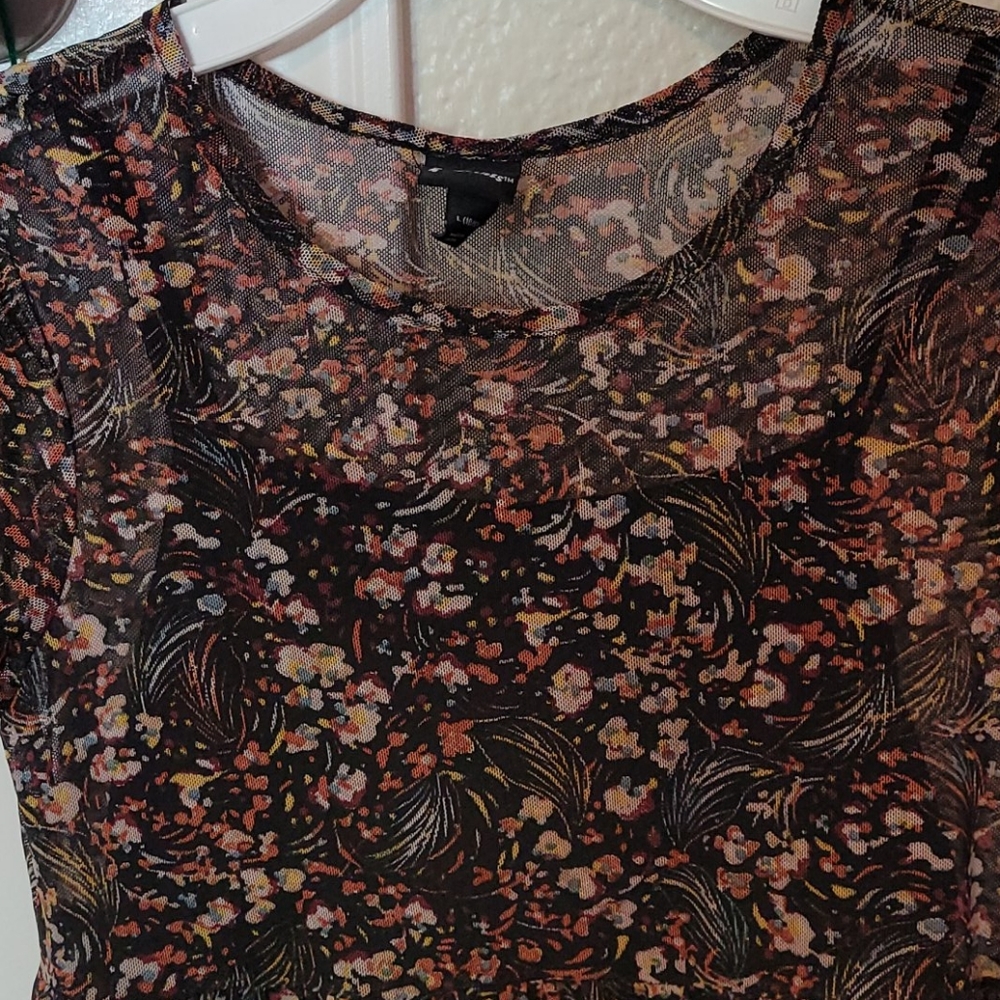 A girl's see through shirt with flower pattern